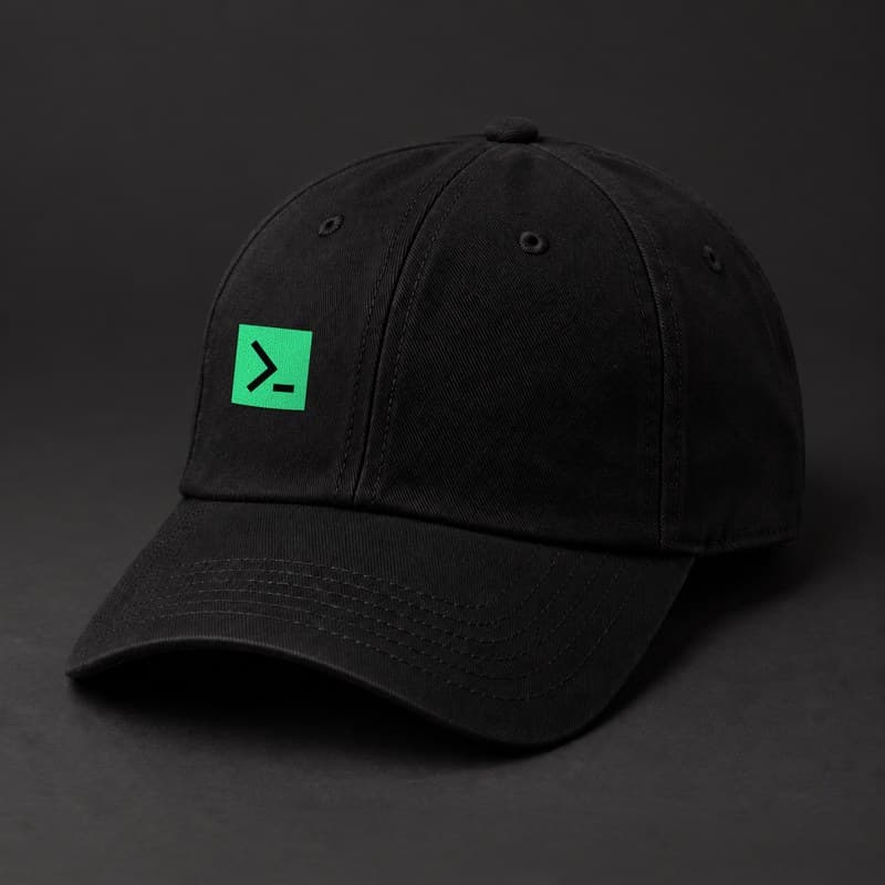 Mockup of a black baseball cap with the solid green MinerTerminal tile, a black terminal prompt on a green square, on the front