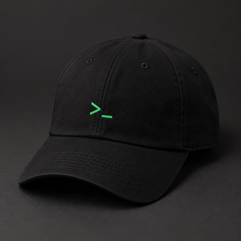 Mockup of a black baseball cap with a small green terminal prompt mark